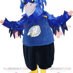 Mascot blauw zwart en geel vogel. Raven mascotte -